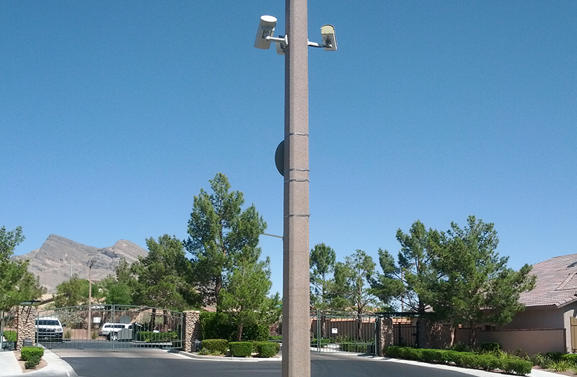 Surveillance cameras mounted on a pole.