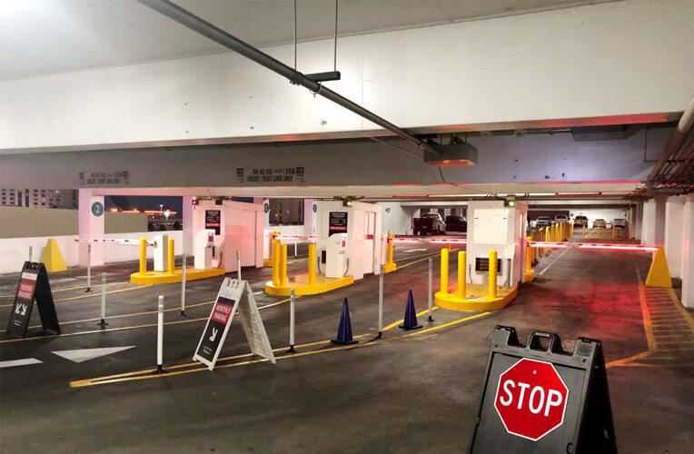 Parking automation with barriers and pay stations.